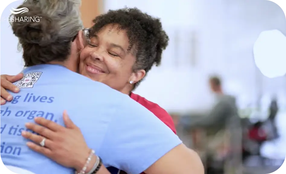 two women hug